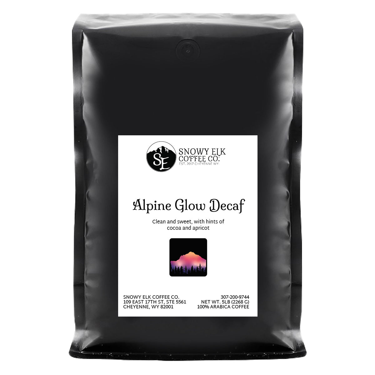 A bag of Snowy Elk Coffee Co. Alpine Glow Decaf, showing the coffee packaging with a mountain logo, a depiction of a deer, and the Swiss Water Process label.