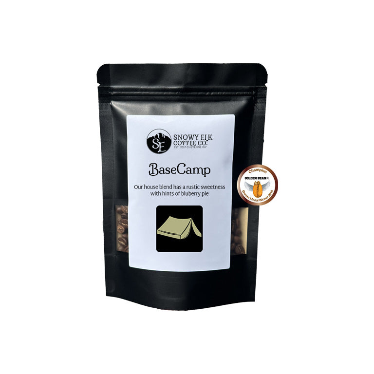 Black coffee bag labeled 'BaseCamp' from Snowy Elk Coffee Co. on a white background