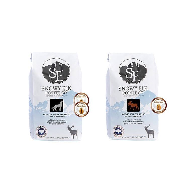 Two packages of Snowy Elk Coffee Co. espresso blend, one labeled as Dark Moose Espresso Blend and the other as Howlin' Wolf Espresso Blend, each with a white background and branding elements.
