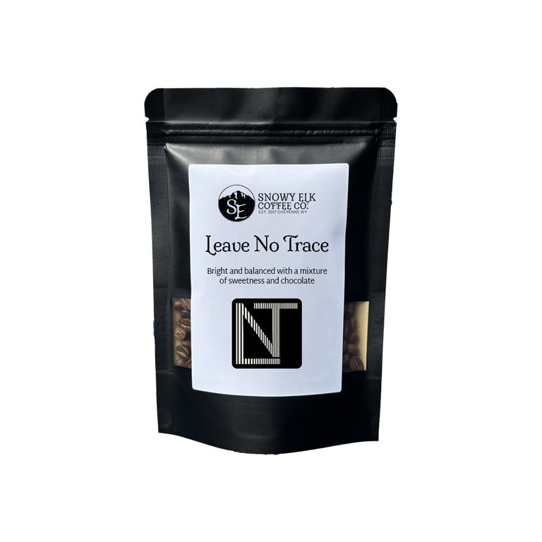 Black coffee bag with a label on a white background Black coffee bag with a label on a white background