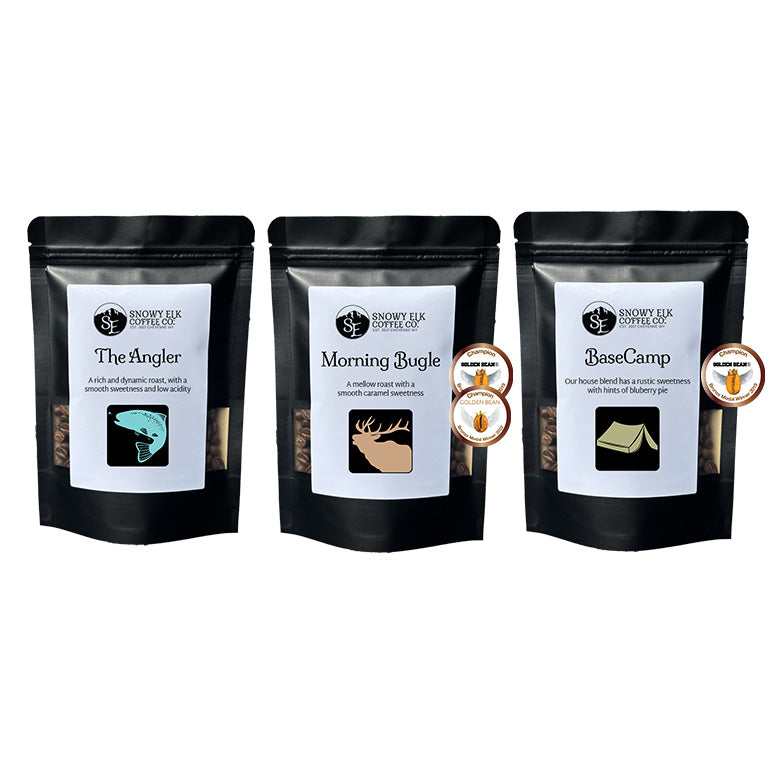 Three black coffee bags with labels 'The Angler', 'Morning Bugle', and 'Base Camp' on a white background. Three black coffee bags with labels 'The Angler', 'Morning Bugle', and 'Base Camp' on a white background.
