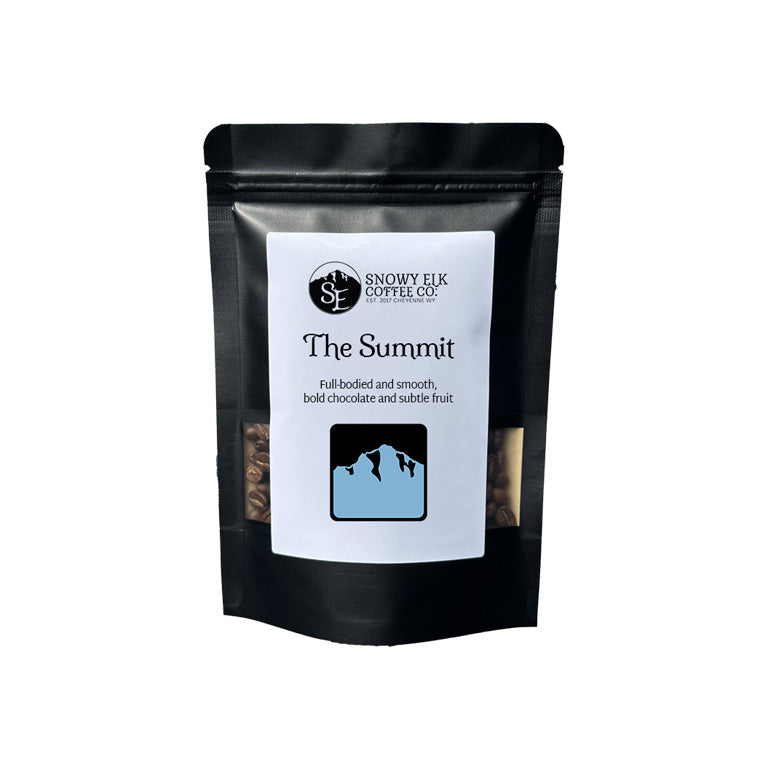 Black coffee bag labeled 'The Summit' from Snowy Elk Coffee Co. on a white background Black coffee bag labeled 'The Summit' from Snowy Elk Coffee Co. on a white background