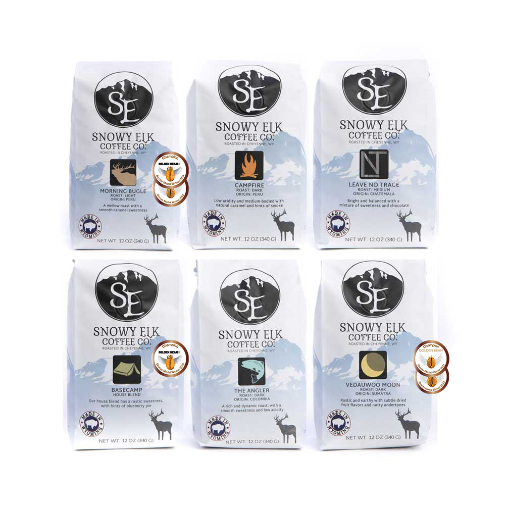 A variety pack of Snowy Elk coffee bags featuring different coffee roasts and single-origin coffees. A variety pack of Snowy Elk coffee bags featuring different coffee roasts and single-origin coffees.