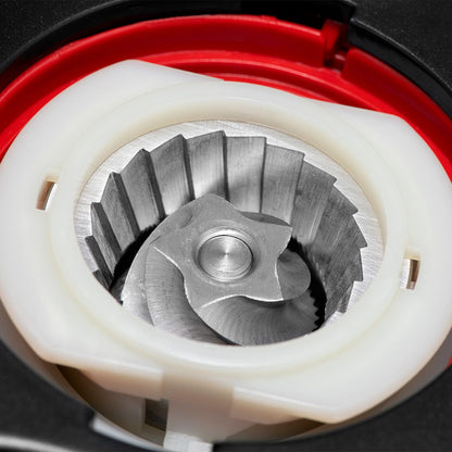 The inside of a burr grinder showing the burrs