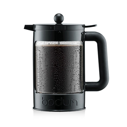 Black Bodum coffee press with coffee inside on a white background