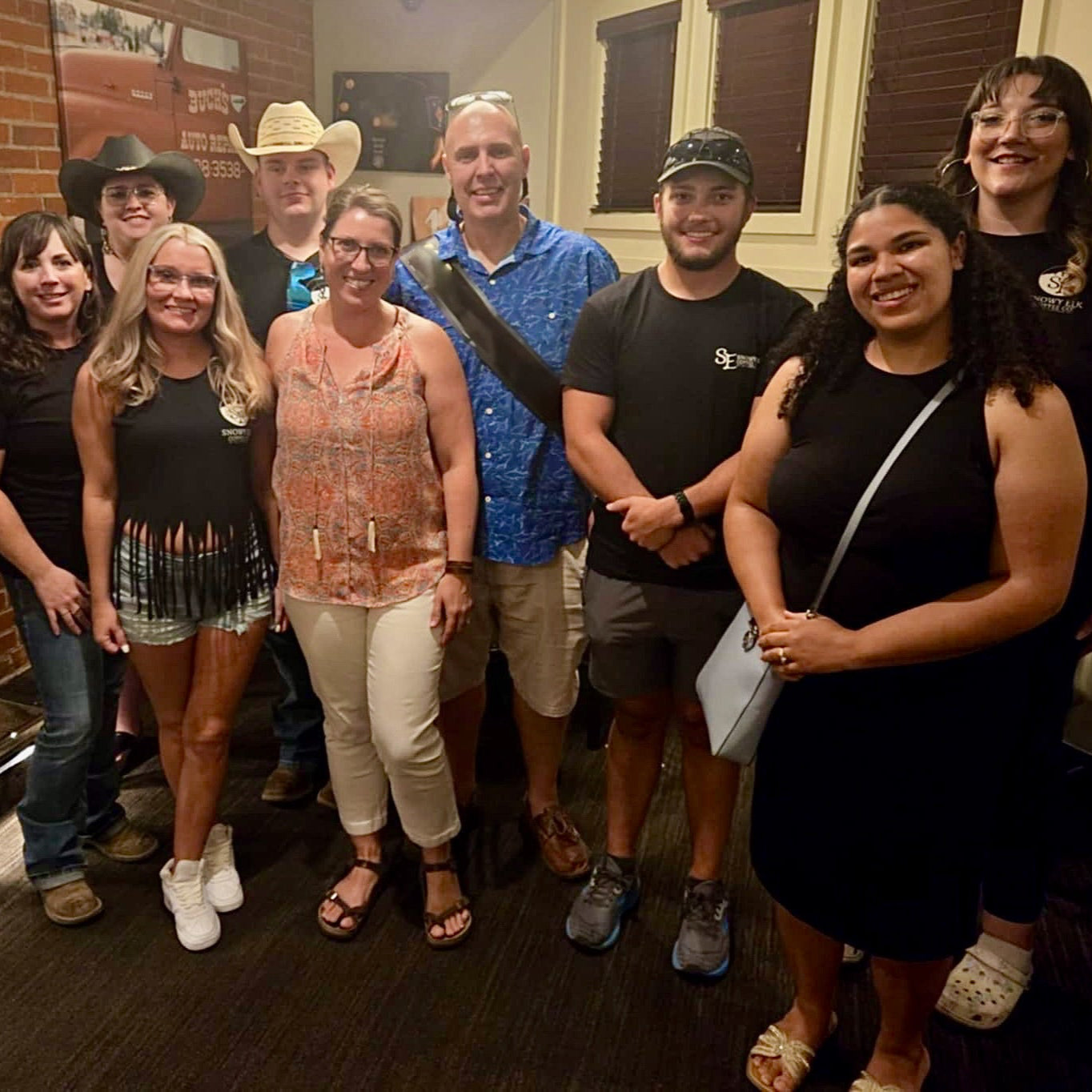 A group of people standing in a restaurant 