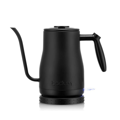 A black gooseneck kettle with the words BODUM written on the bottom on a white background