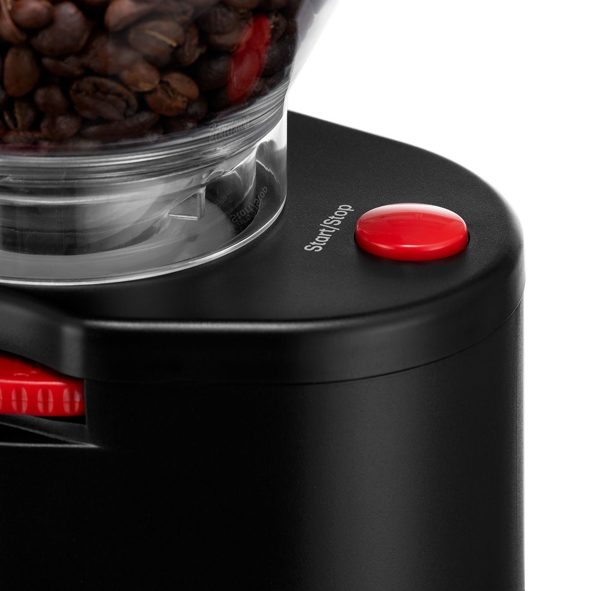 A close up of a red button that says start/stop