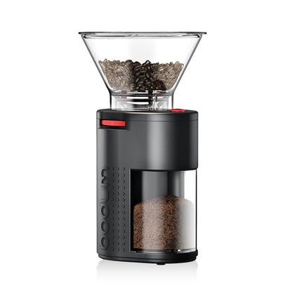 A black burr grinder with a clear reservoir on top on a white background