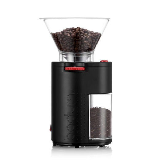 A black burr grinder with a clear reservoir on top on a white background