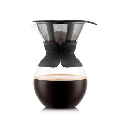 A BODUM Pour Over coffee maker with a black handle and clear glass body filled with coffee.