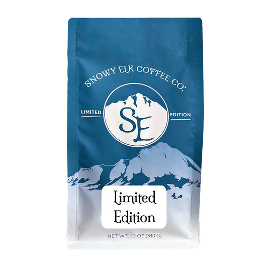 A bag of Snowy Elk Coffee Co. Limited Edition coffee with a mountain design and branding on the packaging. A bag of Snowy Elk Coffee Co. Limited Edition coffee with a mountain design and branding on the packaging.