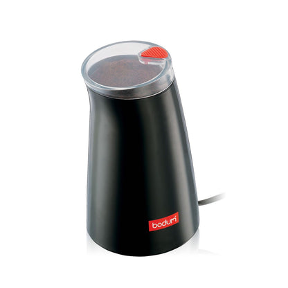A small black coffee grinder with red accents on a white background